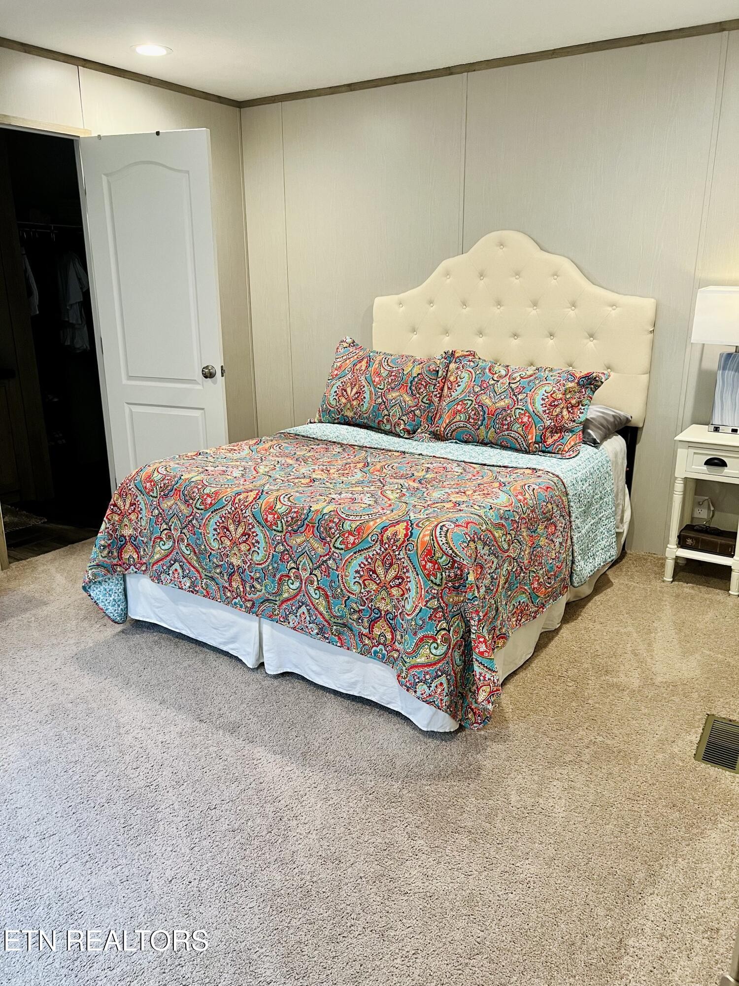 186 Perkins Trail Deer Lodge, TN 37726 - Photo 44 of 54 a bedroom with a bed and a cabinets