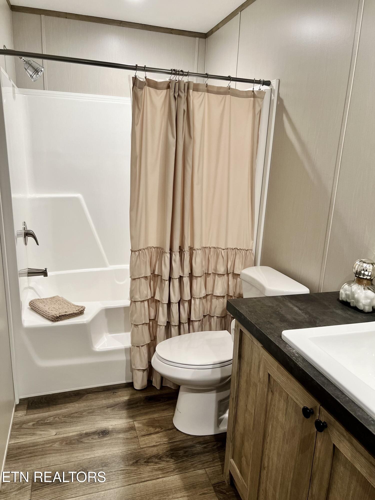186 Perkins Trail Deer Lodge, TN 37726 - Photo 49 of 54 a bathroom with a sink a toilet and shower