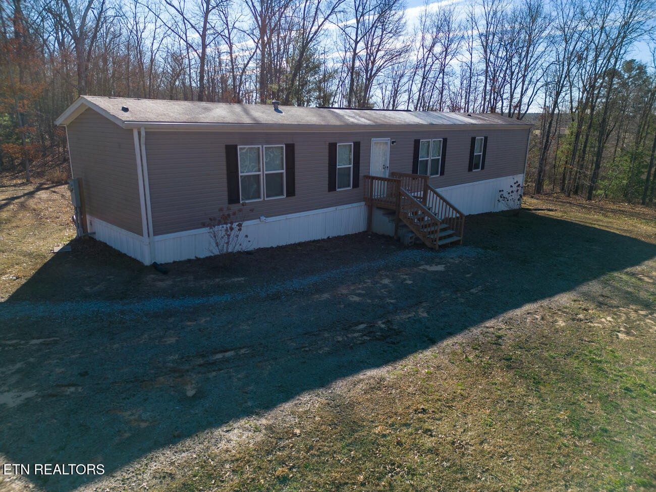 186 Perkins Trail Deer Lodge, TN 37726 - Photo 54 of 54 a view of a house with backyard and sitting area