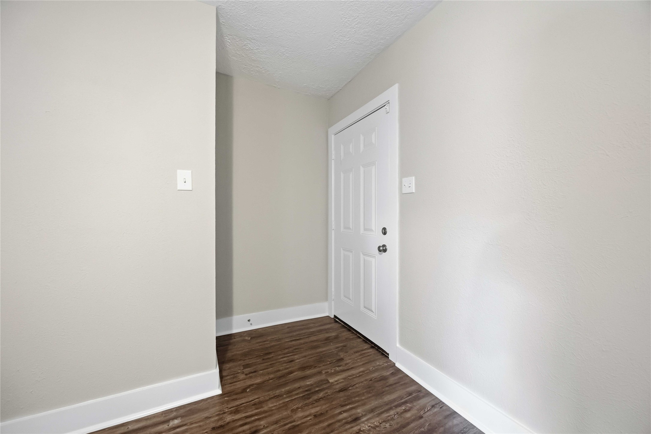 113 East Witcher Lane Houston, TX 77076 - Photo 4 of 21 a view of a hallway with wooden floor