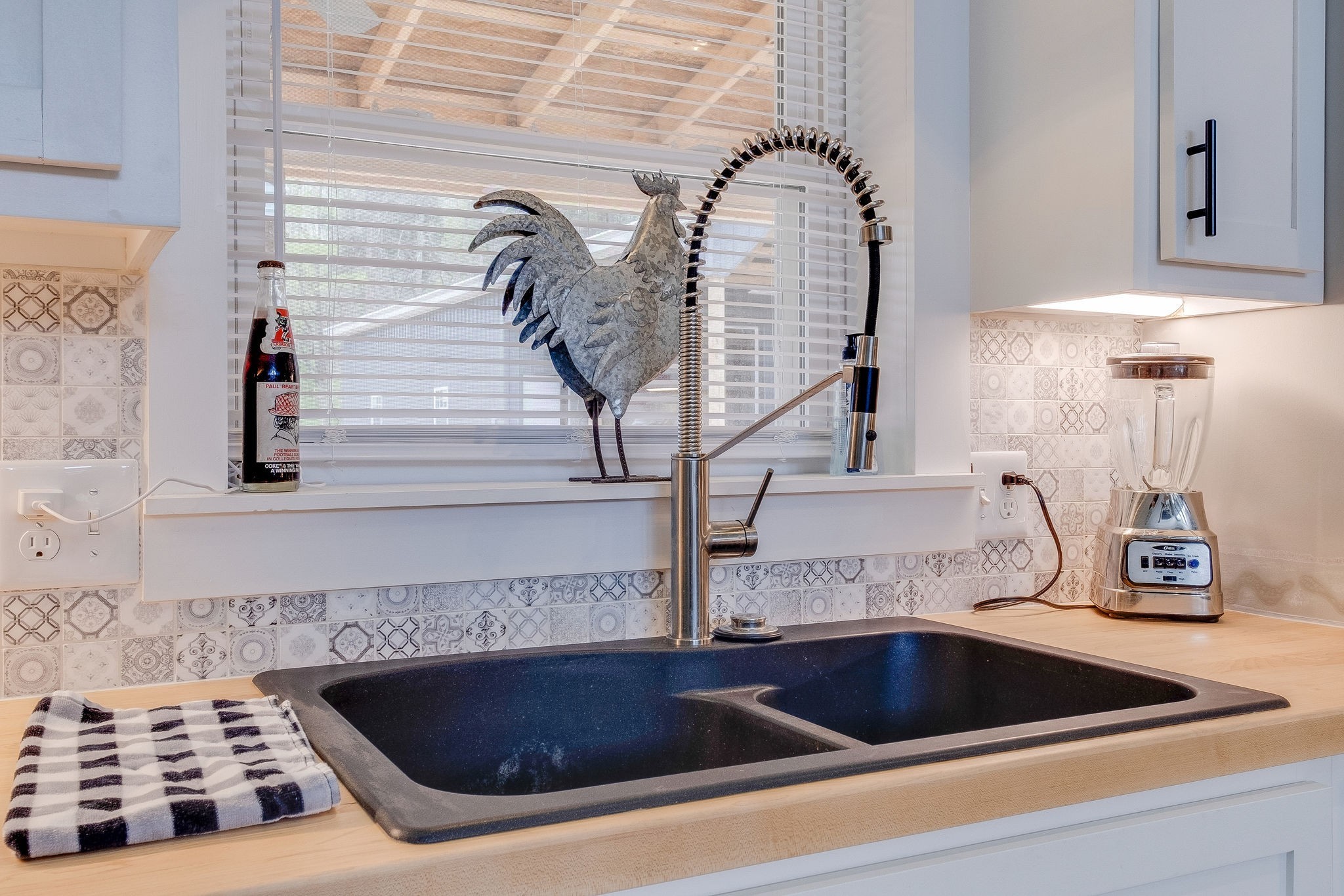 1495 Columbia Road Charlotte, TN 37036 - Photo 13 of 50 a kitchen with a sink and a stove