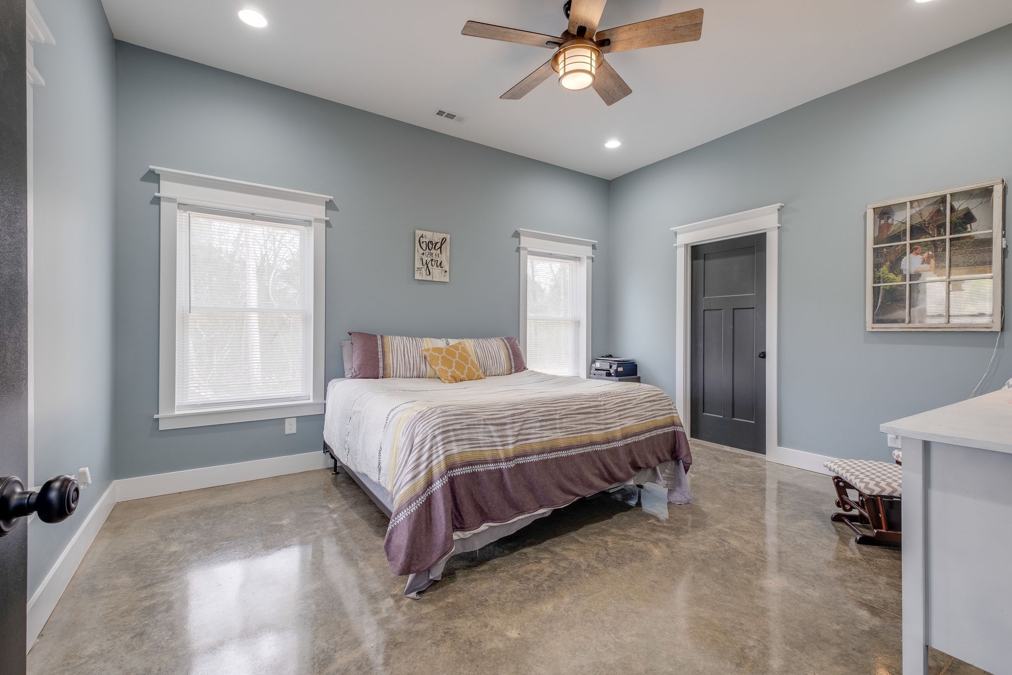 1495 Columbia Road Charlotte, TN 37036 - Photo 16 of 50 a spacious bedroom with a large bed and a chandelier