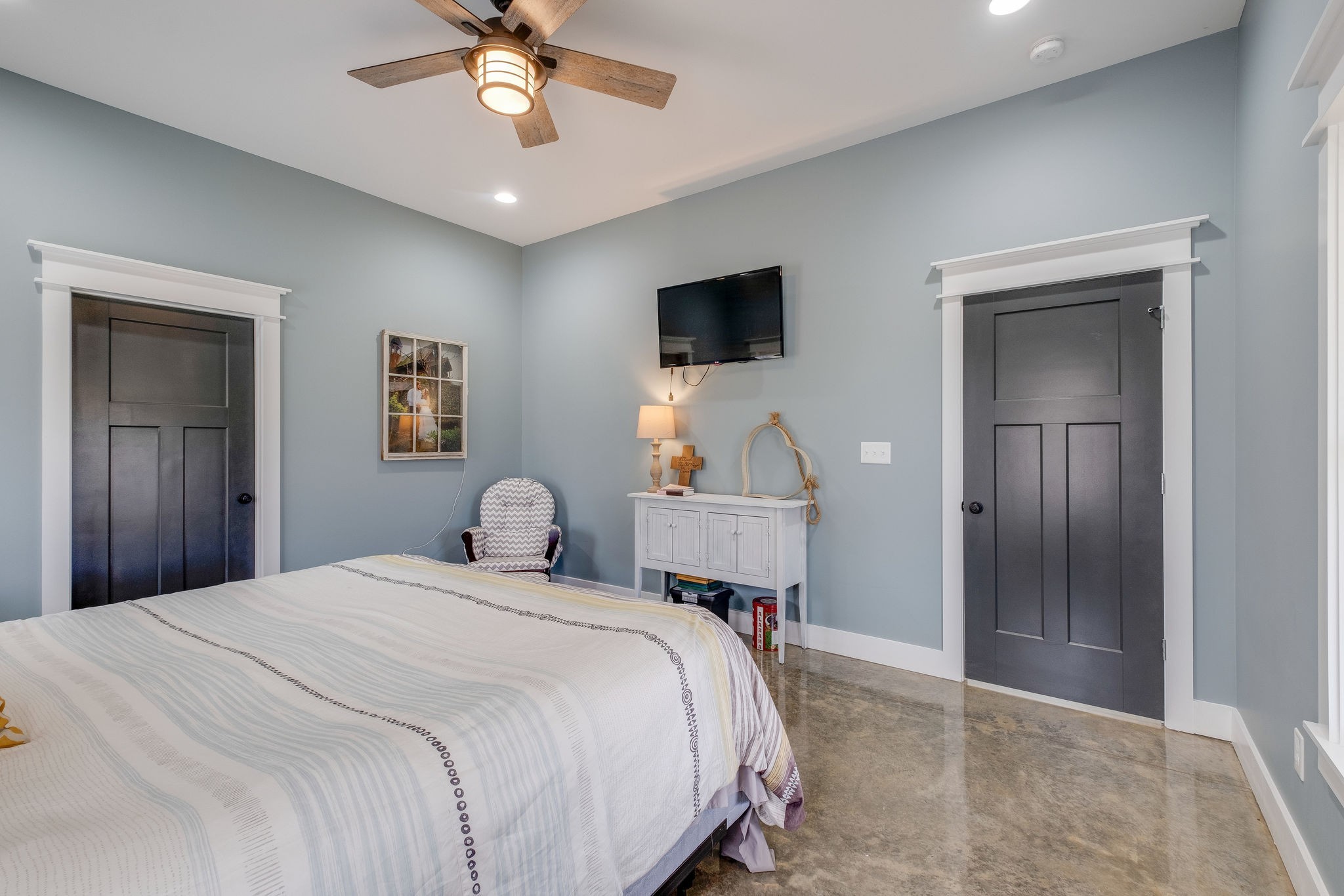 1495 Columbia Road Charlotte, TN 37036 - Photo 20 of 50 a bedroom with a bed and a chandelier