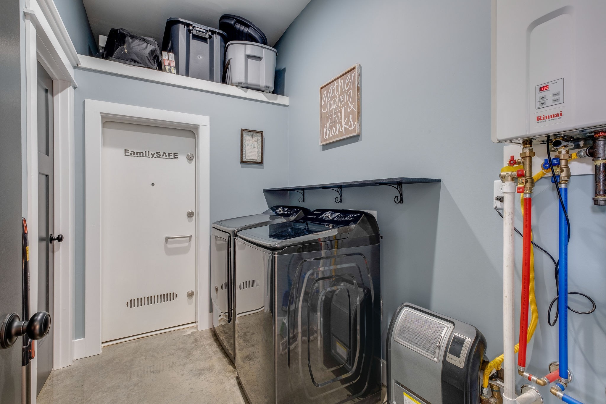 1495 Columbia Road Charlotte, TN 37036 - Photo 22 of 50 a view of walk in closet with clothes and shoes