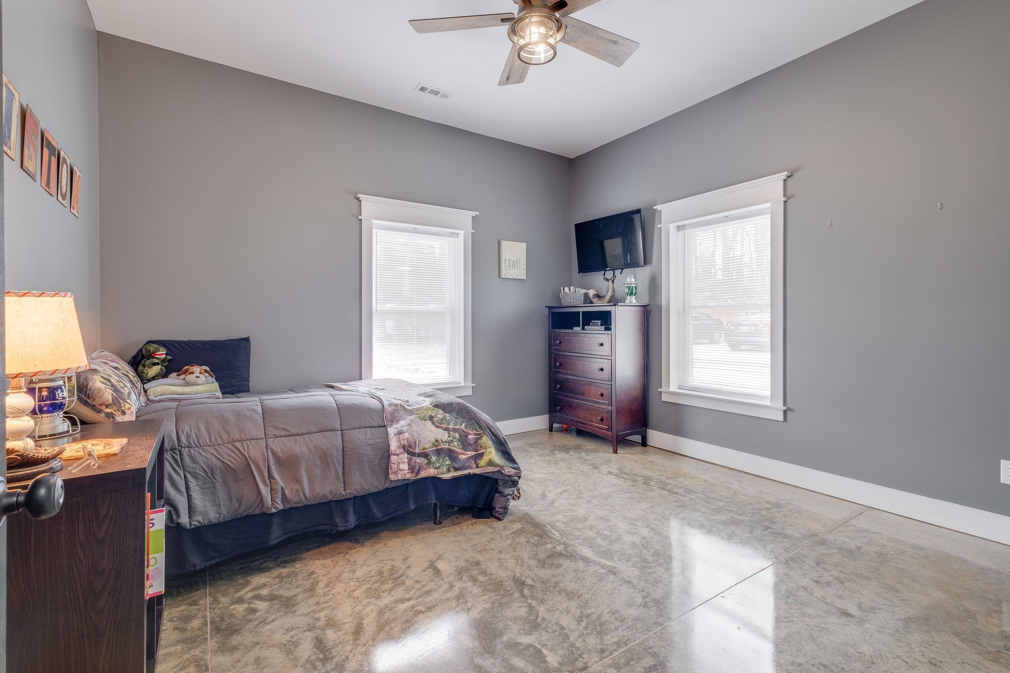 1495 Columbia Road Charlotte, TN 37036 - Photo 23 of 50 a bedroom with a bed and a chandelier