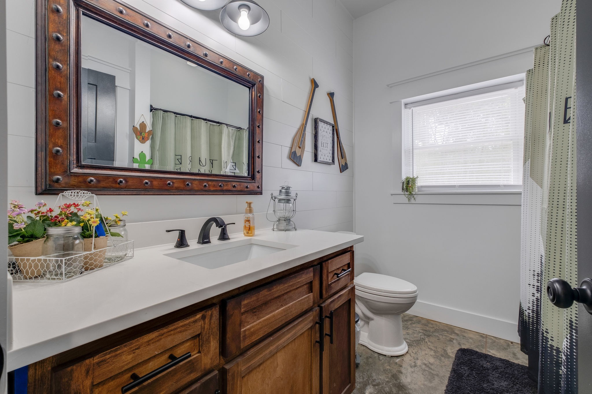 1495 Columbia Road Charlotte, TN 37036 - Photo 25 of 50 a bathroom with a granite countertop sink a toilet and a mirror