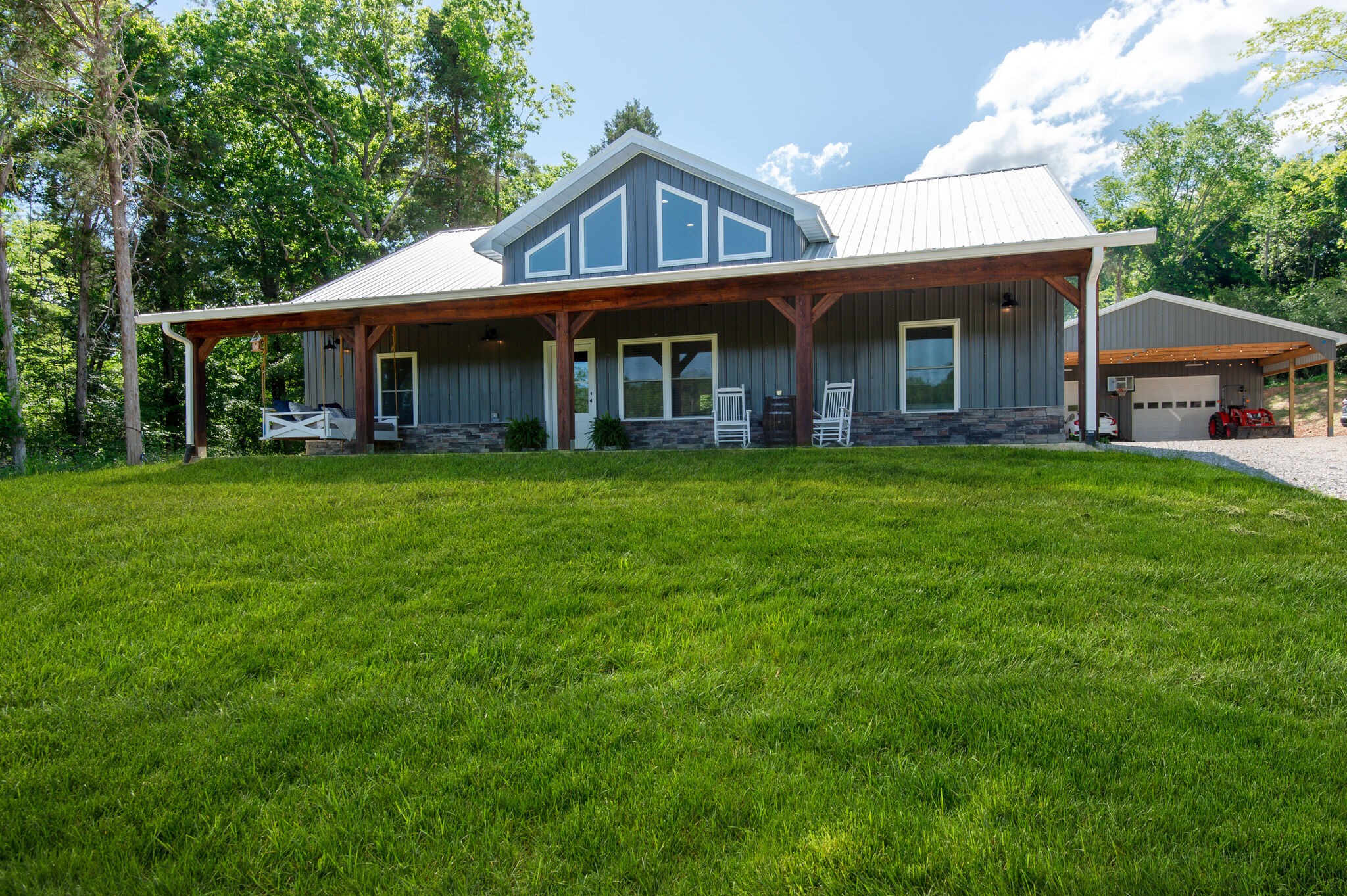 1495 Columbia Road Charlotte, TN 37036 - Photo 3 of 50 a front view of a house with a garden