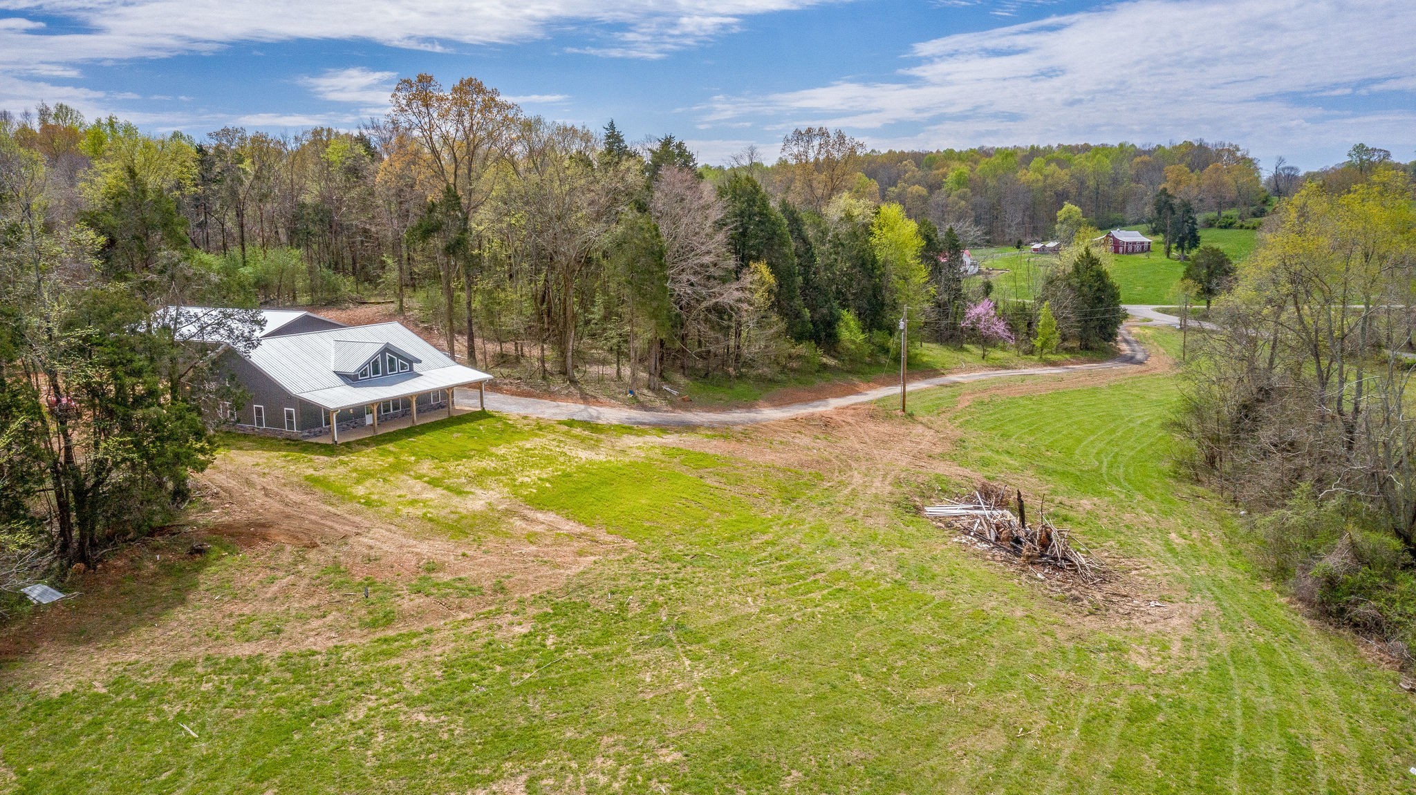 1495 Columbia Road Charlotte, TN 37036 - Photo 31 of 50 a view of a swimming pool with an outdoor seating and a garden