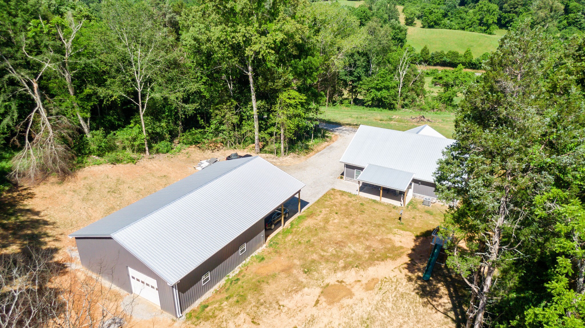 1495 Columbia Road Charlotte, TN 37036 - Photo 49 of 50 an aerial view of a house with yard