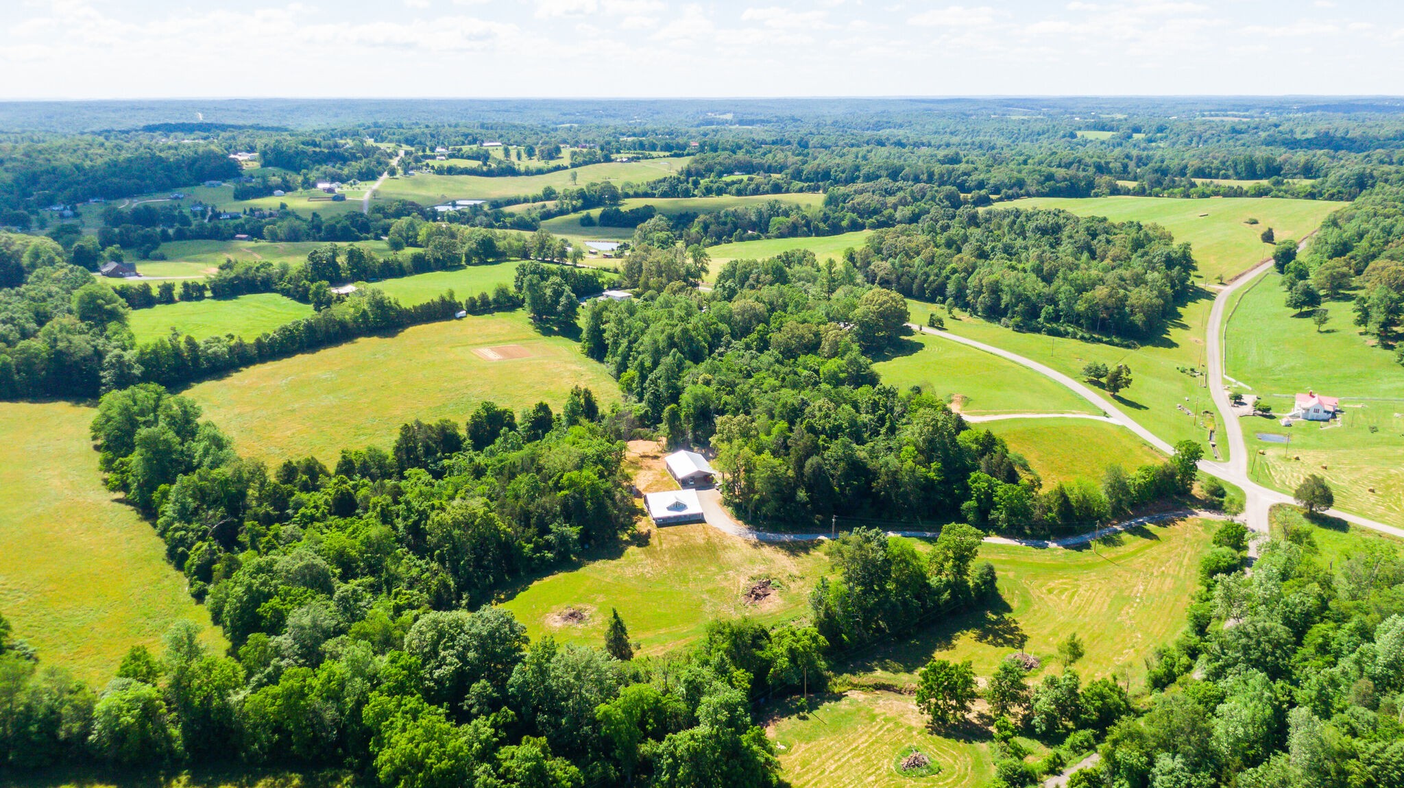 1495 Columbia Road Charlotte, TN 37036 - Photo 50 of 50 an aerial view of lake residential house with swimming pool and green space