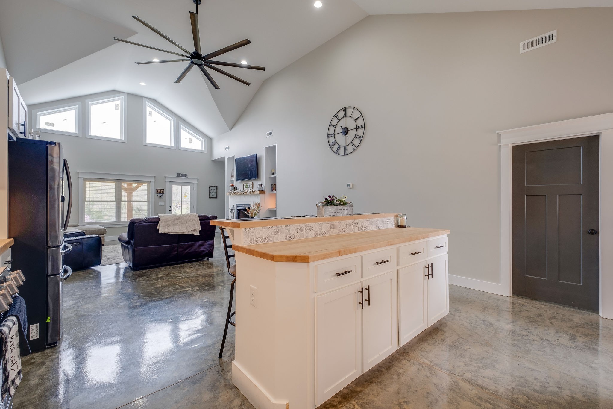 1495 Columbia Road Charlotte, TN 37036 - Photo 9 of 50 a view of a kitchen with kitchen island a counter top space a sink and a chandelier fan