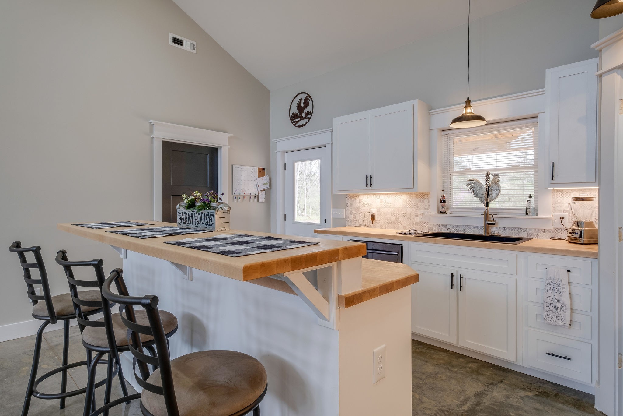 1495 Columbia Road Charlotte, TN 37036 - Photo 10 of 50 a kitchen with stainless steel appliances granite countertop a stove a sink and a refrigerator