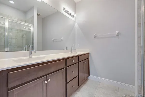 a bathroom with a sink a vanity and a mirror