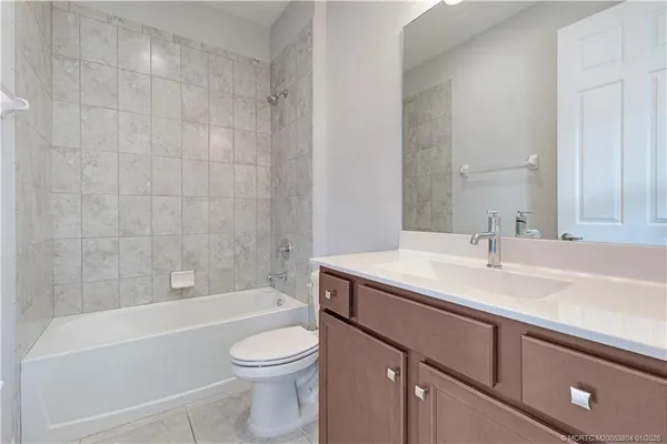 a bathroom with a sink a toilet and a bathtub