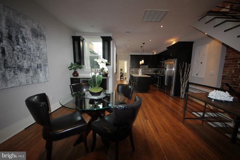2128 1st Street Northwest, Unit 2 Washington, DC 20001 - Photo 11 of 28 a dining room with furniture and wooden floor