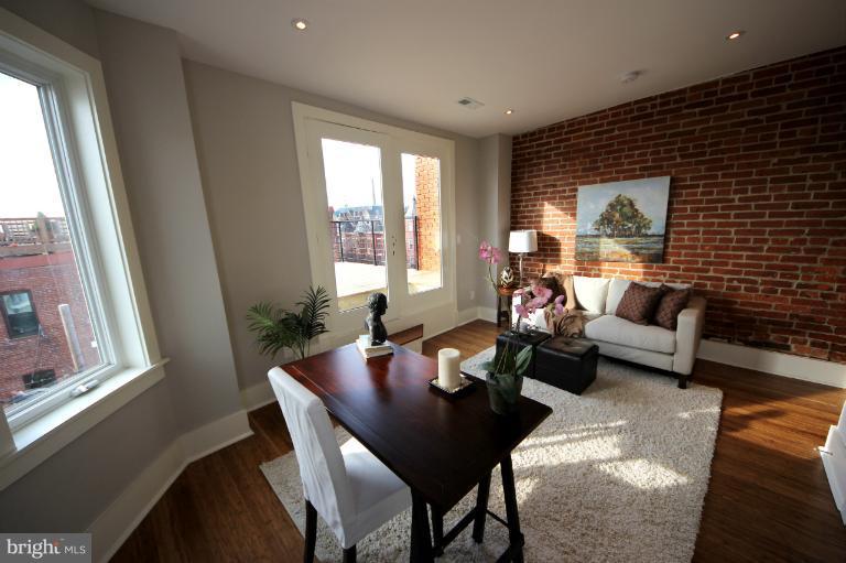 2128 1st Street Northwest, Unit 2 Washington, DC 20001 - Photo 9 of 28 a living room with furniture and a window