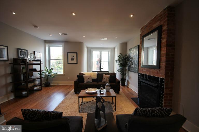 2128 1st Street Northwest, Unit 2 Washington, DC 20001 - Photo 10 of 28 a living room with furniture and a flat screen tv