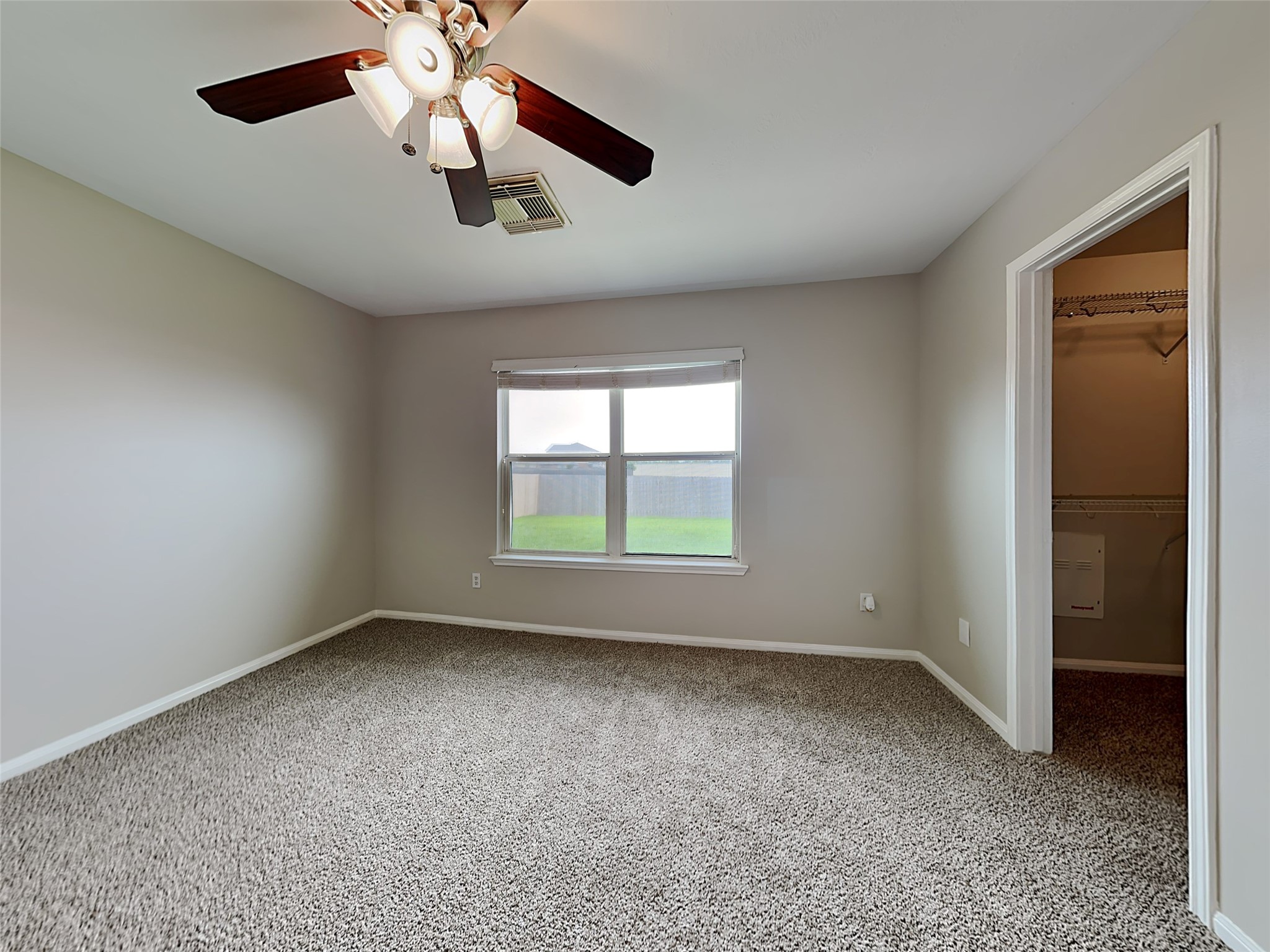 8119 Katie Mill Trail Spring, TX 77379 - Photo 16 of 18 wooden floor in an empty room with a window