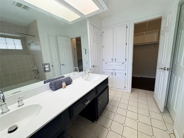 an empty room with a window and doors