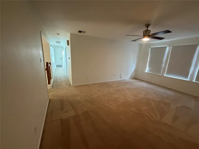 a room that has a couch and a dresser in it