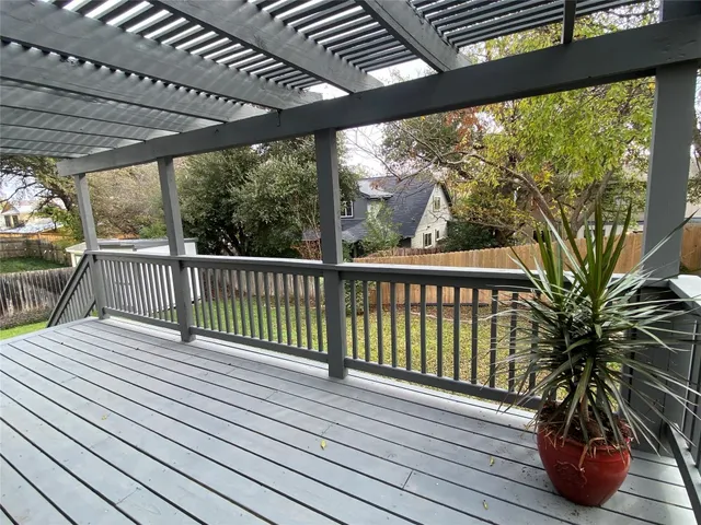 a view of balcony with wooden floor