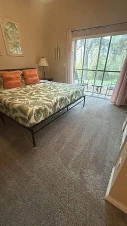 a view of a room with lounge chair and a table