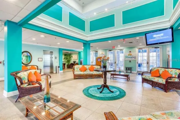 a lobby with furniture and rug