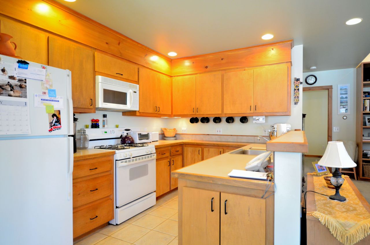 43 Pinnacle Road Otis, MA 01253 - Photo 6 of 16 a kitchen with stainless steel appliances granite countertop a sink and cabinets