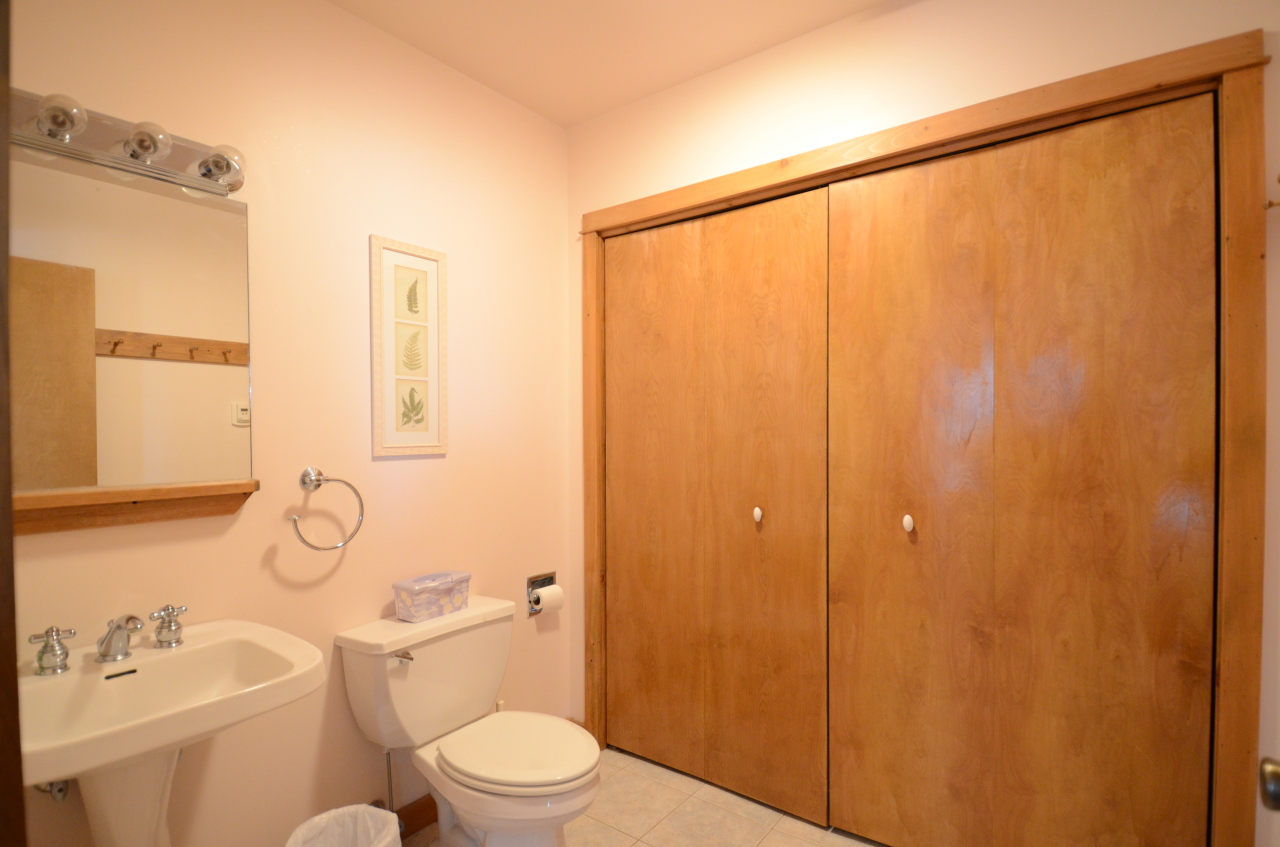 43 Pinnacle Road Otis, MA 01253 - Photo 8 of 16 a bathroom with a granite countertop toilet a sink and a shower