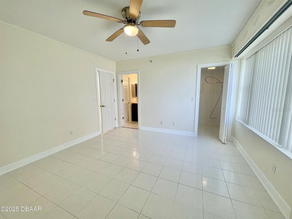 4575 South Atlantic Avenue, Unit 6203 Ponce Inlet, FL 32127 - Photo 19 of 34 an empty room with closet and a ceiling fan