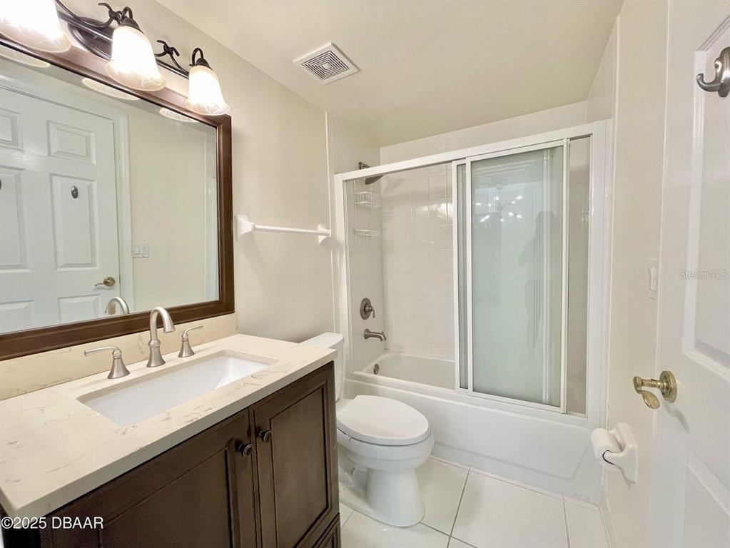 4575 South Atlantic Avenue, Unit 6203 Ponce Inlet, FL 32127 - Photo 20 of 34 a bathroom with a sink a toilet and shower