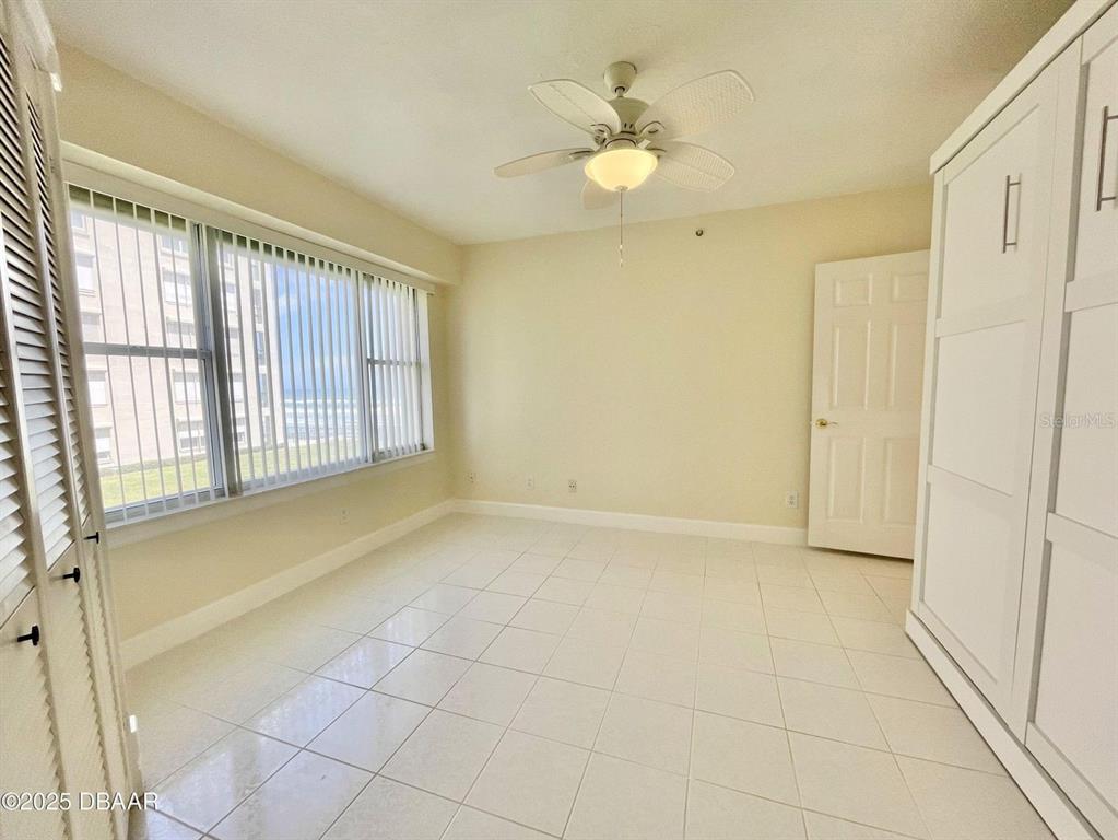 4575 South Atlantic Avenue, Unit 6203 Ponce Inlet, FL 32127 - Photo 22 of 34 a view of an empty room with a window
