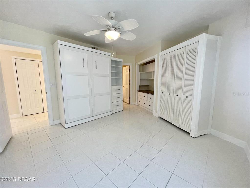 4575 South Atlantic Avenue, Unit 6203 Ponce Inlet, FL 32127 - Photo 23 of 34 an empty room with closet and fan