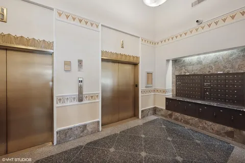 a view of a hallway with closet and bathroom