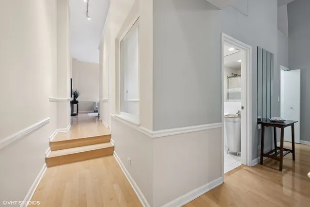 a bedroom with a bed and chair