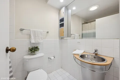 a bedroom with a bed and a lamp