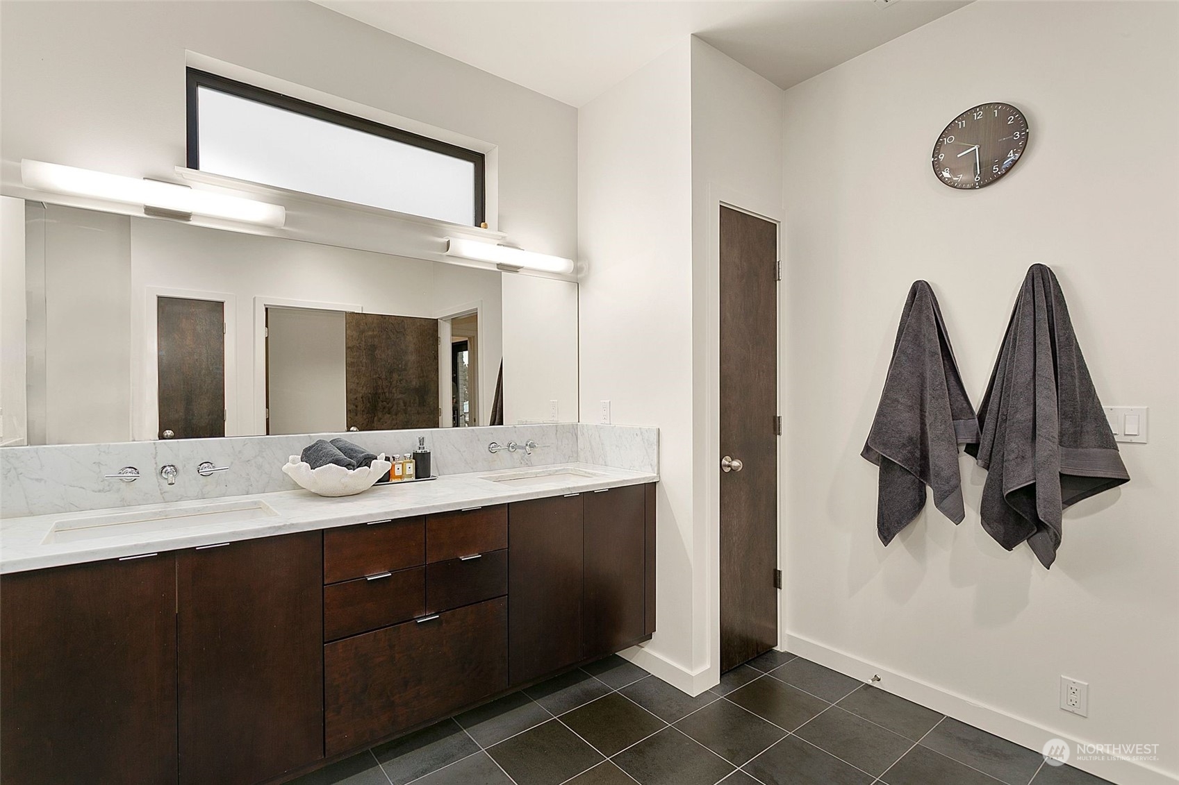 2717 36th Avenue Southwest Seattle, WA 98126 - Photo 17 of 40 a bathroom with a double vanity sink and mirror