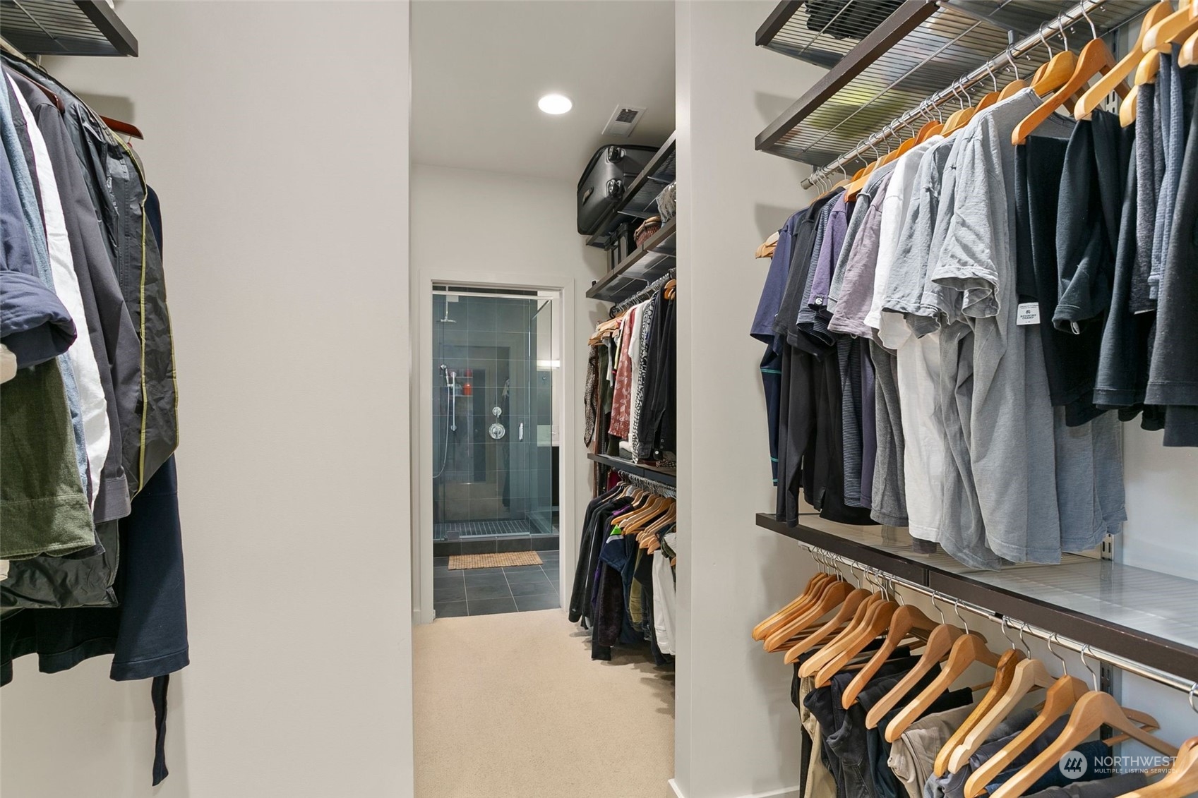 2717 36th Avenue Southwest Seattle, WA 98126 - Photo 18 of 40 a view of walk in closet with clothes and shoes