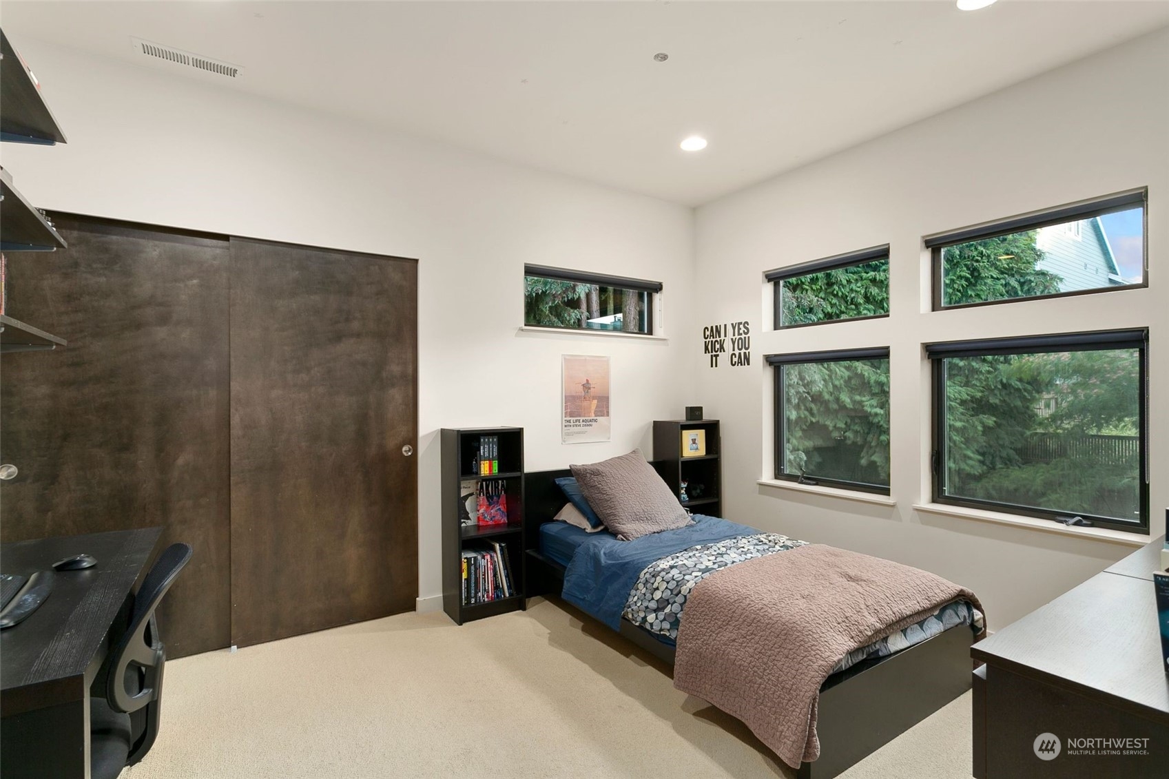 2717 36th Avenue Southwest Seattle, WA 98126 - Photo 19 of 40 a bedroom with a large bed and a window
