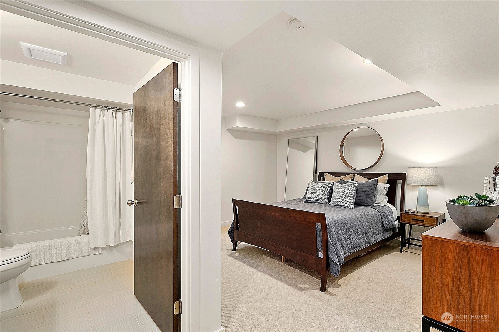 2717 36th Avenue Southwest Seattle, WA 98126 - Photo 26 of 40 a bedroom with a bed and window