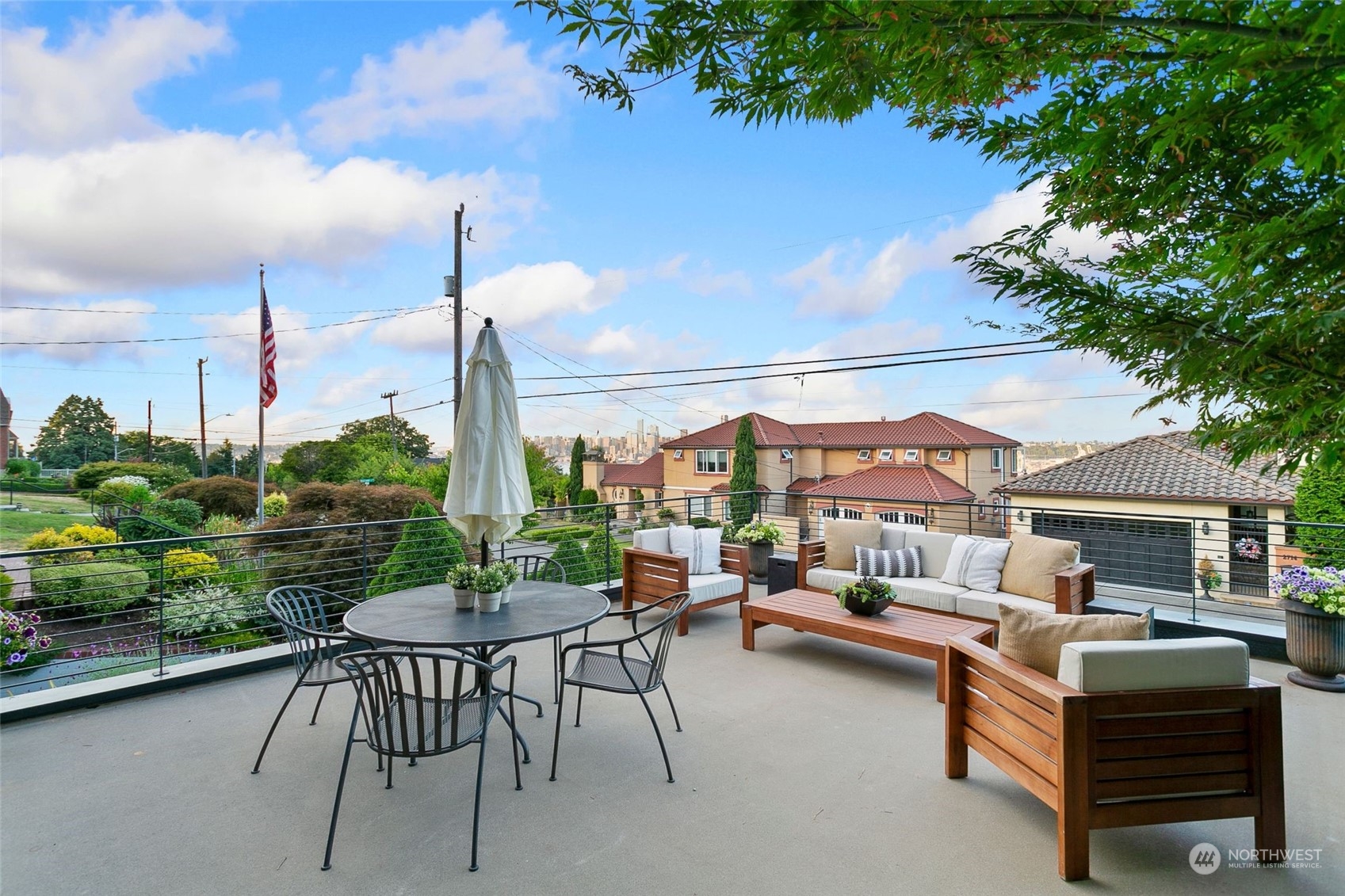 2717 36th Avenue Southwest Seattle, WA 98126 - Photo 30 of 40 a view of a patio with couches table and chairs