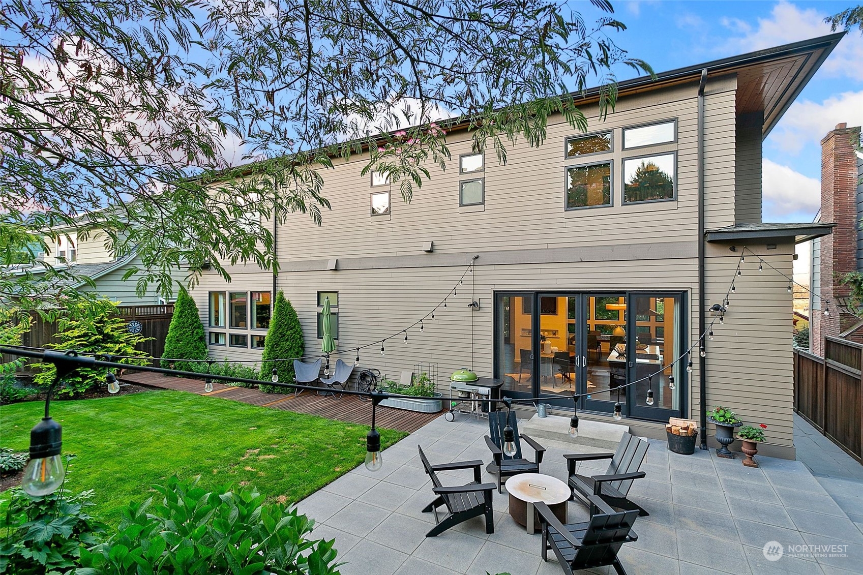 2717 36th Avenue Southwest Seattle, WA 98126 - Photo 32 of 40 a building outdoor space with patio furniture and garden