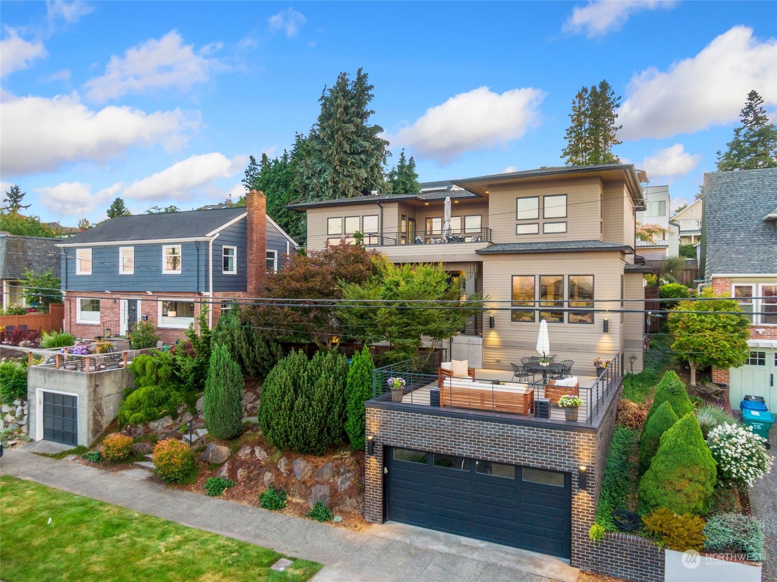 2717 36th Avenue Southwest Seattle, WA 98126 - Photo 39 of 40 a front view of a house with a garden