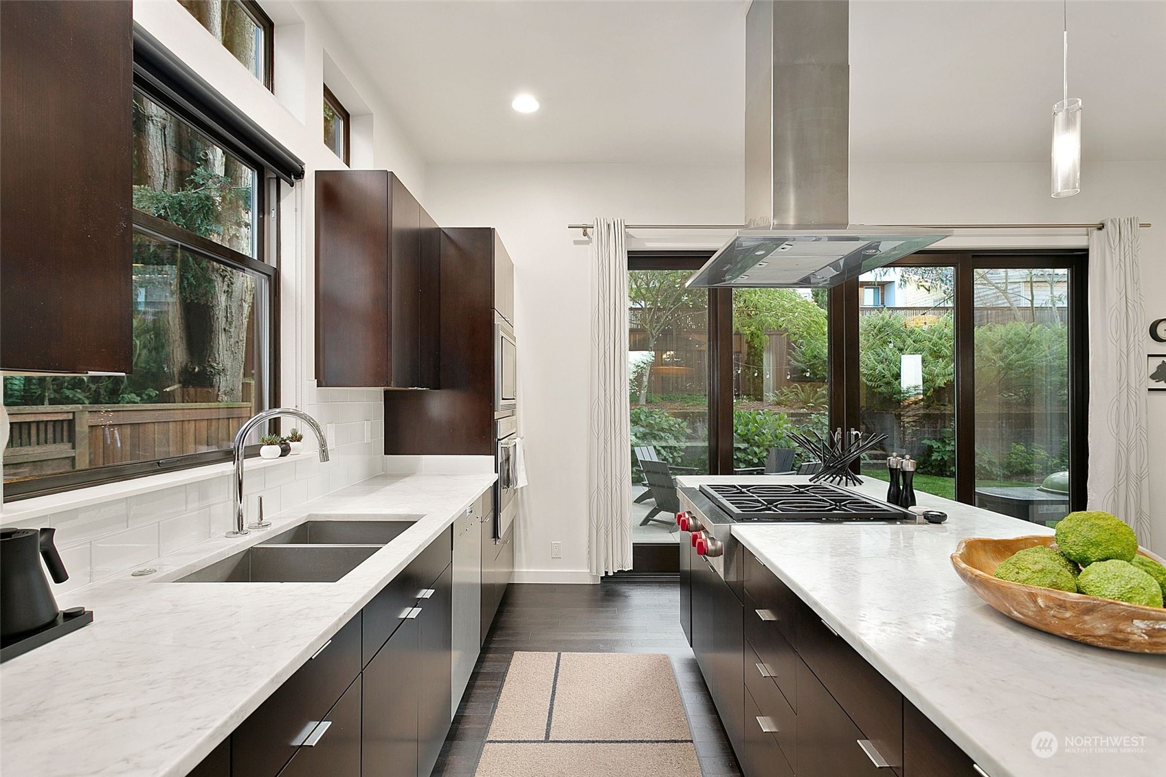 2717 36th Avenue Southwest Seattle, WA 98126 - Photo 10 of 40 a large kitchen with a large window and stainless steel appliances