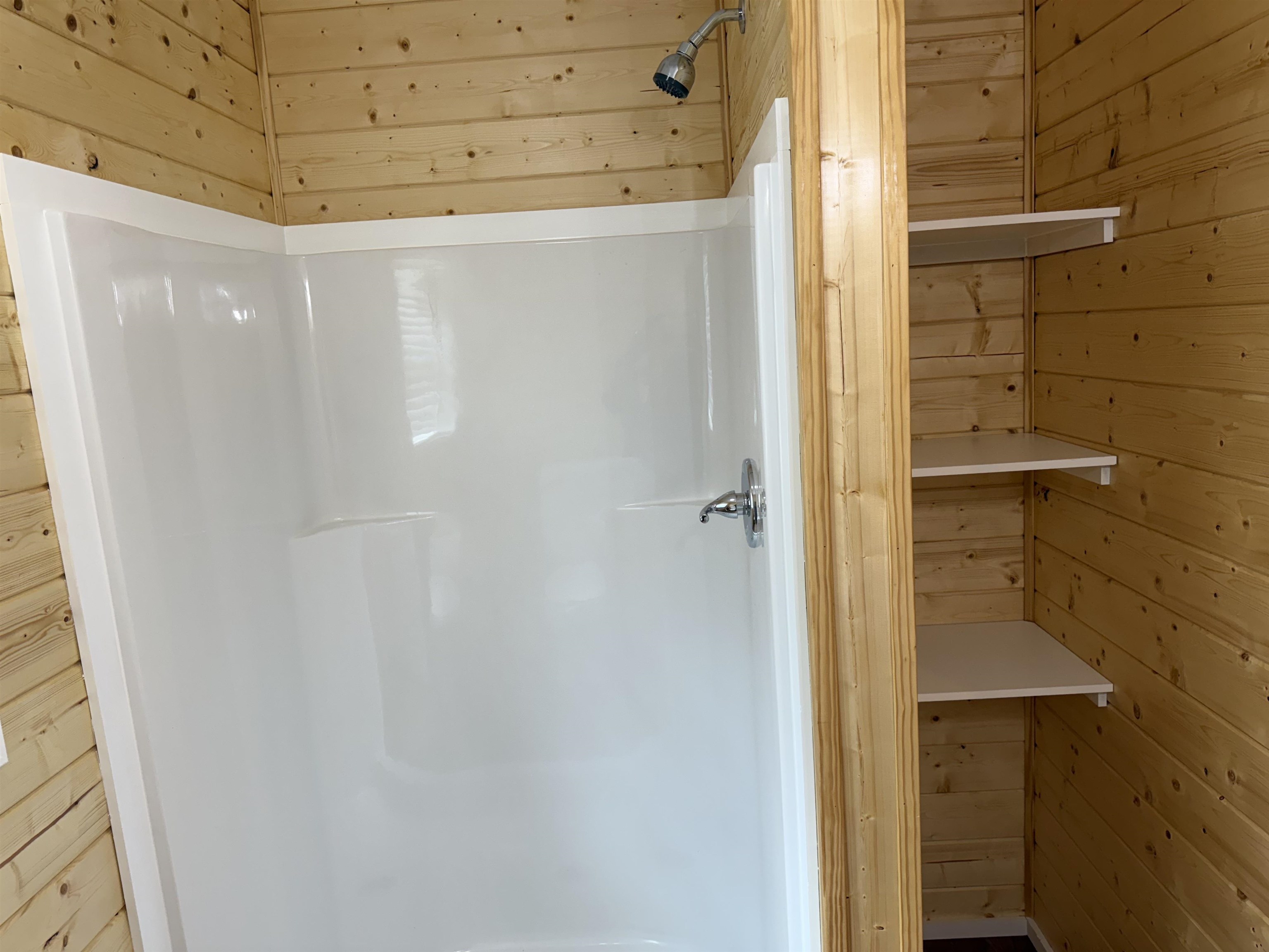 104 Young Drive Selmer, TN 38375 - Photo 11 of 12 a bathroom with a shower