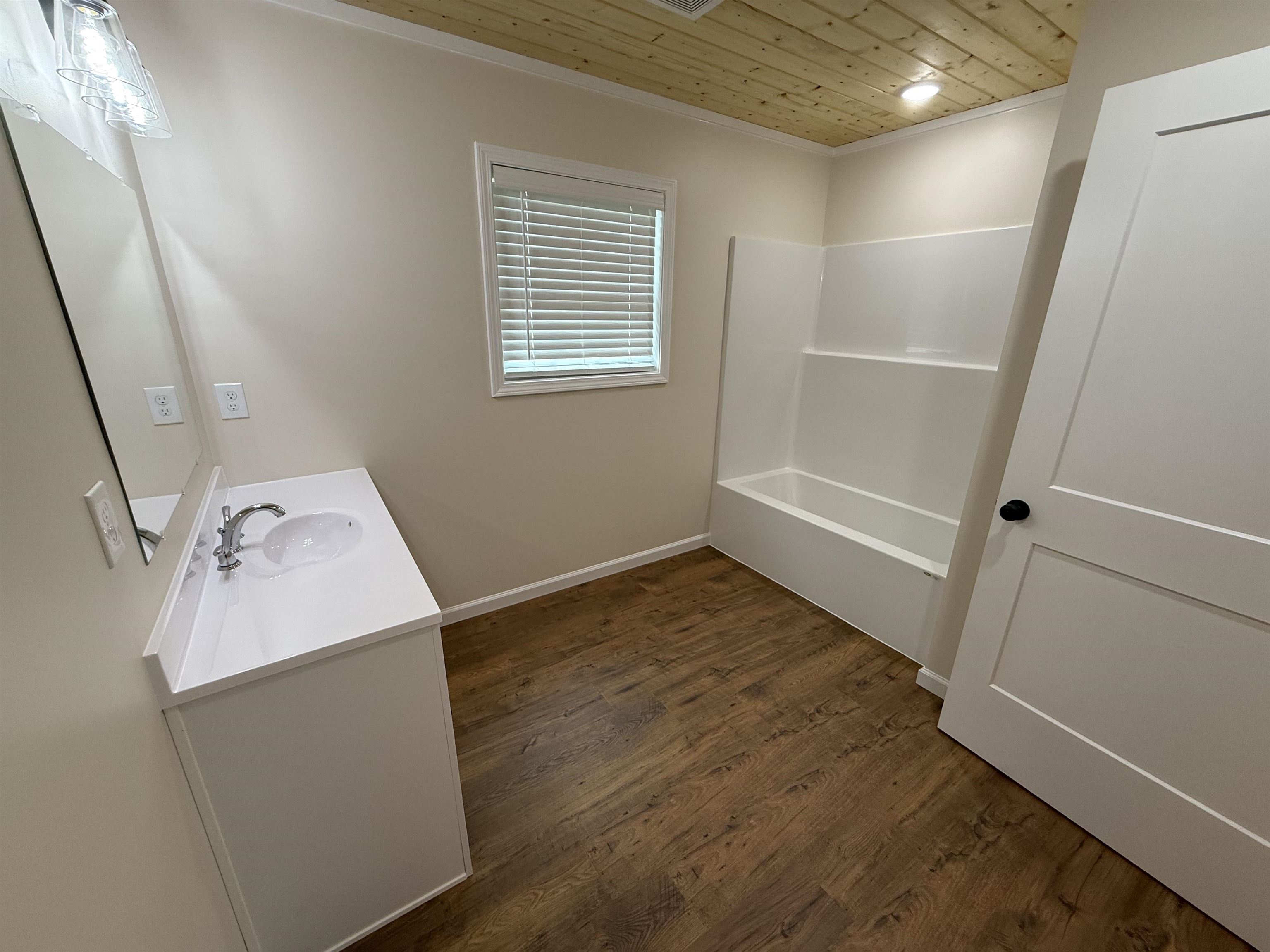 104 Young Drive Selmer, TN 38375 - Photo 6 of 12 a view of utility room with wooden floor