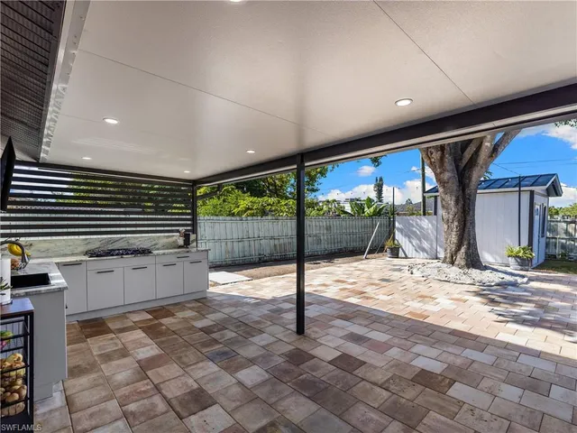 a view of a backyard of the house