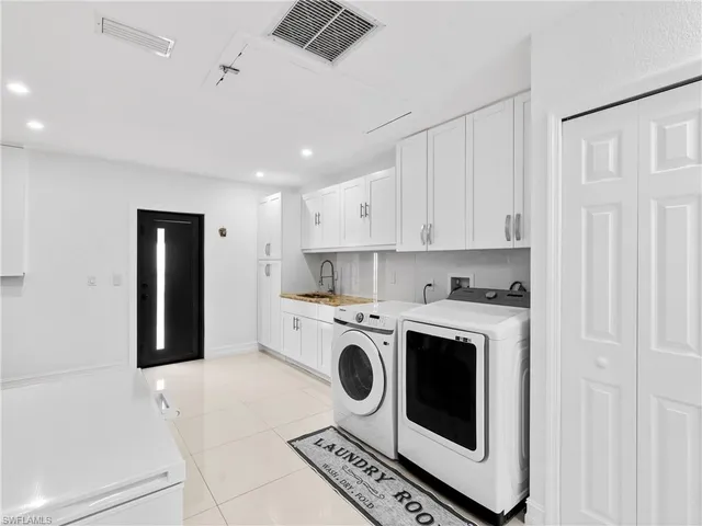 a view of a kitchen with electric appliances