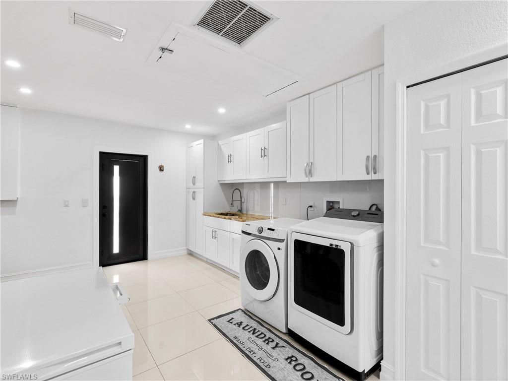 1837 51st Terrace Southwest Naples, FL 34116 - Photo 23 of 35 Garage Non-conforming, converted to include: oversized Laundry room, pantry ample cabinets for storage, large single basin deep sink, quartz countertops 4th bedroom w/walk in closet, all cooled home by central AC