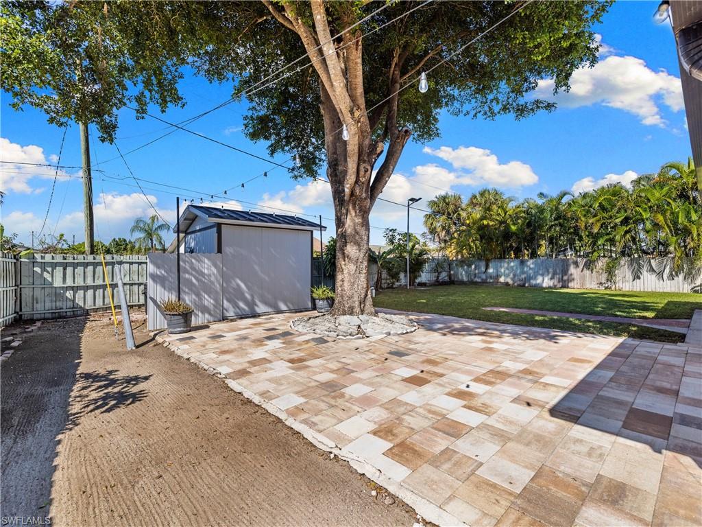 1837 51st Terrace Southwest Naples, FL 34116 - Photo 26 of 35 Fenced backyard w/storage shed